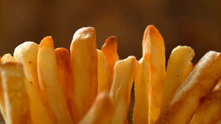 A bunch of fried French fries, close-up.