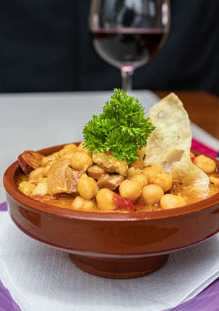 Tipical Canarian dish, Garbanza, with cheakpeas, pork, tomato, peppers, onion and paprika.の写真素材