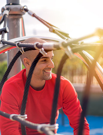 Young man relaxing and walking at the park, enjoing life and smiling in the afternoon