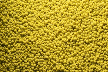 Beads of yellow colour. background