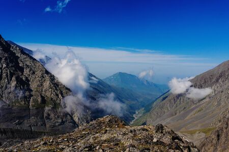 Clouds and mountains, Caucas Mountains, Karmadon, Russiaの写真素材