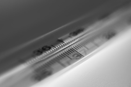 one thermometer the center isolated on white backround close-upの写真素材