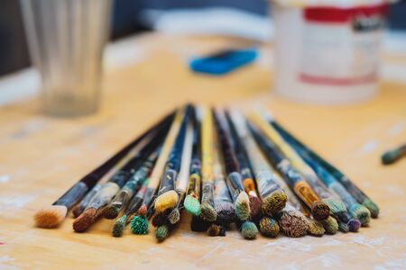 Paint Brushes on a wooden table, closeup