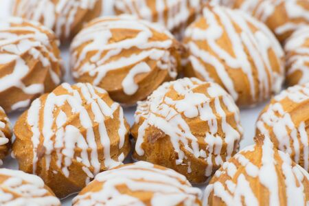 custard cookies with icing for tea. closeup