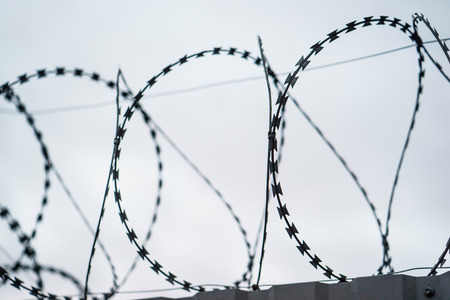 Fence with barbed wire. focus with shallow depth of field