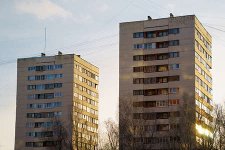 residential house on blue sky background. Block of flats from soviet times.の写真素材