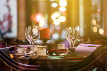 table for event with flower vases, towels and wine glassesの写真素材