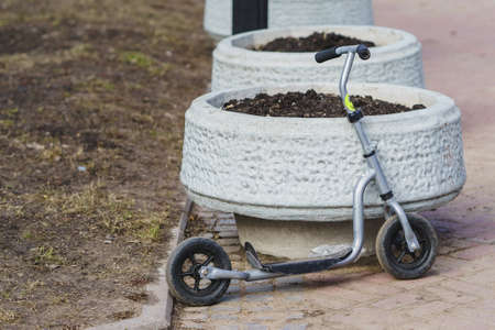 children's scooter in the streetの写真素材