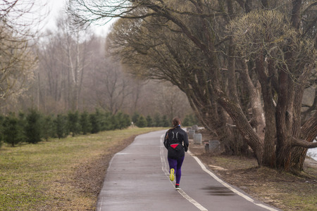 girl runs track in the Park