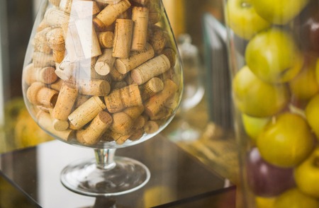 large glass corks. decorated. apples in a vaseの写真素材