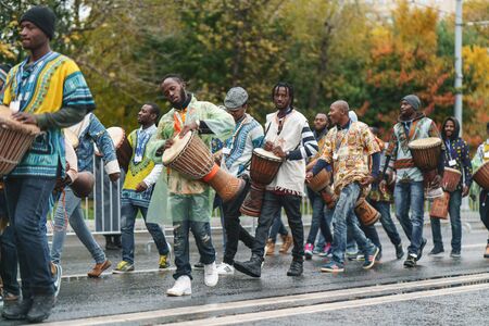 MOSCOW, RUSSIA, 14 OCTOBER 2017: Carnival parade in Moscow dedicated to the 19th World Youth Day and students. African musicians play drumsのeditorial素材