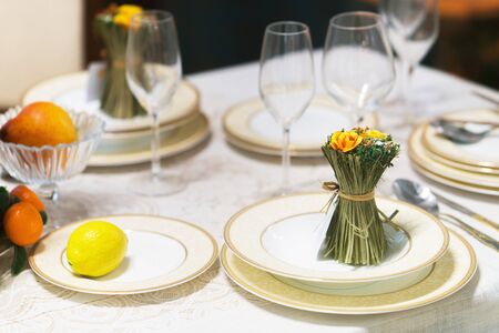 Beautiful table set with flowers for a festive event, party or wedding receptionの写真素材