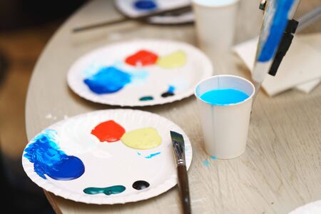 Palette with oil paint on the tableの写真素材