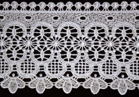 white lace over black background