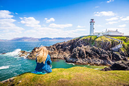 Women Panorama beach sea view in Ireland ocean coast. Atlantic mountain cliffs and rocks. Beautiful landscape nature.の写真素材