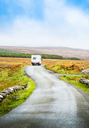 Beautiful road in Ireland with campers. Scenic Irish countryside landscape nature.の写真素材