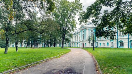 Smolny Garden Park in Saint Petersburg, Russia. Walkway with Green Trees Alleyの写真素材