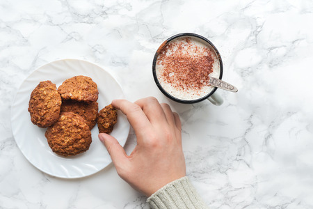 Fresh cookies and warm chocolate latte. Top view.の写真素材