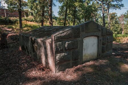 Road and ancient crypt in the old catholic cemetery.の写真素材