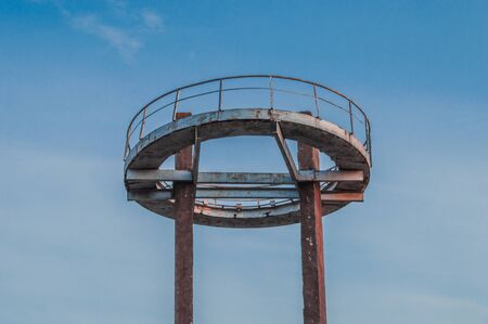 Tower on the old ruined scene. Tower on background from blue sky.の写真素材
