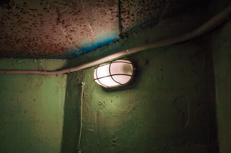 Old lamp on the green wall in the hooperの写真素材