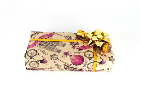 Gift box with a little bow isolated on white backghround. Closeup photo of Christmas or birthday presentの写真素材