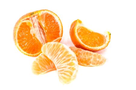 Orange mandarins,  tangerine peel or mandarin slice isolated on white background. Closeup photos of fresh citrus fruit.の写真素材