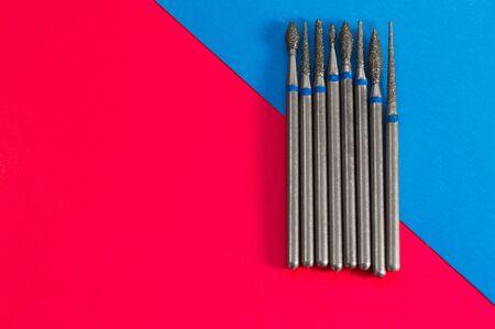 Ð¡utter for manicure and pedicure closeup on blue and pink background.の写真素材