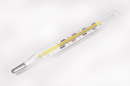 Thermometer closeup on white background. Closeup photo of medical preparations.