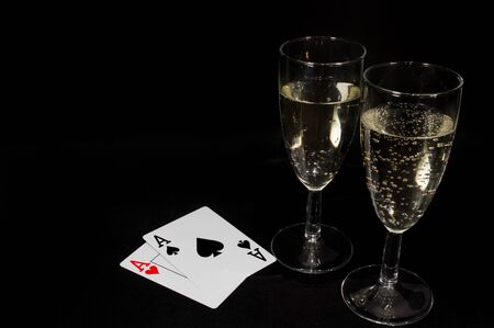Champagne glass isolated on black background. Closeup photo of alcohol