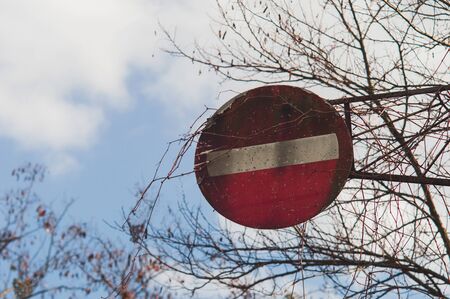 Old sign Road-up with cracked paint. Red road signの写真素材