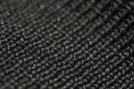 Black texture of nylon fabric on bag. Abstract photo closeupの写真素材