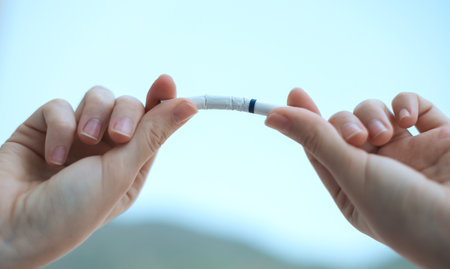 Stop smoking, quit or no smoking cigarettes. Woman holding broken cigarette in hands. Woman Refusing Cigarettes. Quit bad habit.の写真素材
