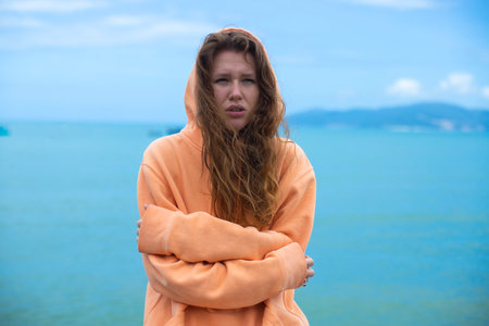 Portrait of unhappy depressed frozen trembling girl, young shivering from cold sad upset woman on...