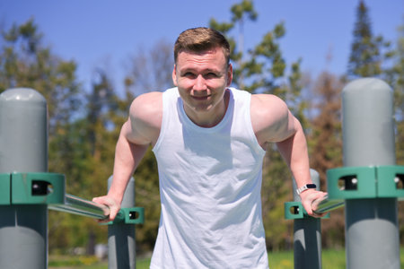 Young fit strong man training outdoors. Fitness, healthy lifestyle concept.