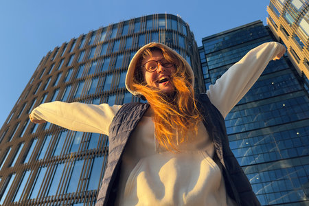 Portrait of happy teenager girl or young woman university or college student in glasses outdoors smile, have funの写真素材