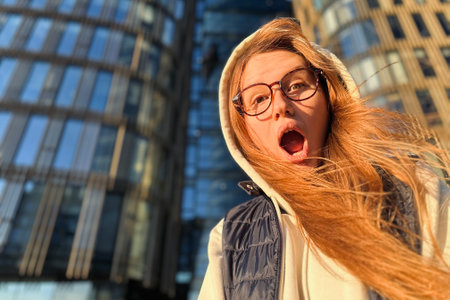 Portrait of happy teenager girl or young woman university or college student in glasses outdoors smile, have funの写真素材