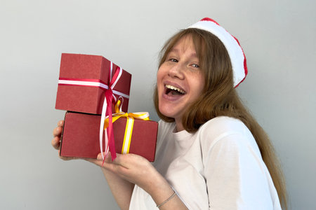 young happy and beautiful woman with gift in hand, have fun. concept christmas, new year, isolated...