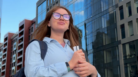 Happy young student girl outdoors
