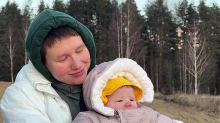 Happy mother with her daughter walkingの写真素材