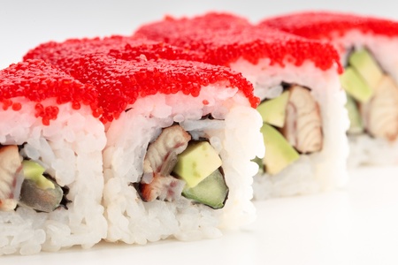 California rolls on a white background with red caviarの写真素材
