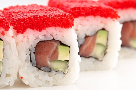 California rolls on a white background with red caviarの写真素材