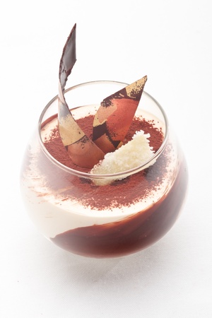 Caramel cream with ginger snaps decorated with chocolate on a white backgroundの写真素材