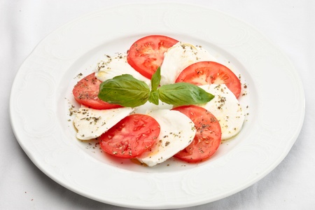 Close up of Caprese salad - tomatoes, mozzarella and basilの写真素材