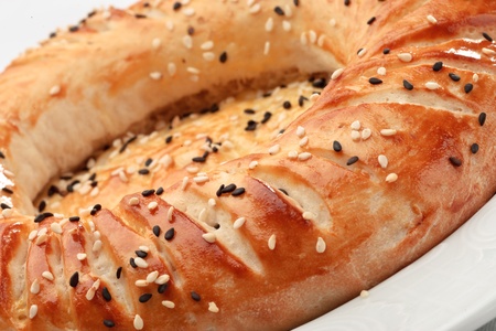 Close up of original fresh uzbek bread isolated on a white backgroundの写真素材