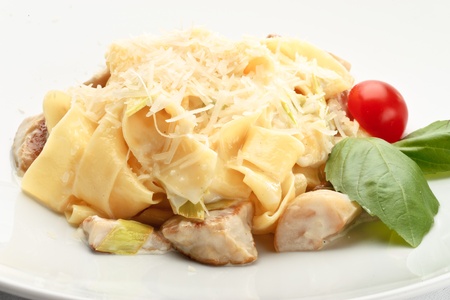 Close-up of papardelle with mushrooms decorated on a white backgroundの写真素材