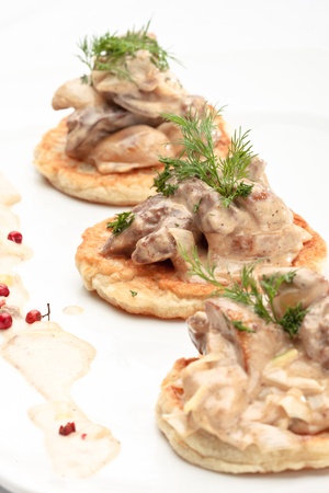 potato pancakes on plate with with mushrooms and dillの写真素材