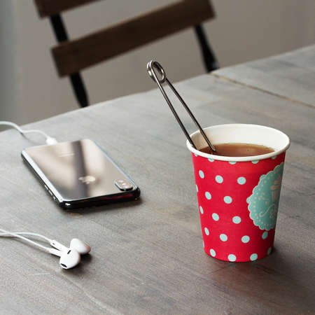 Lunch break. Coffee mug on the tableの写真素材