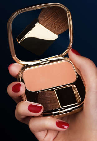 woman applying makeupの写真素材