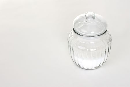 A jar of sugar on a white background.の写真素材